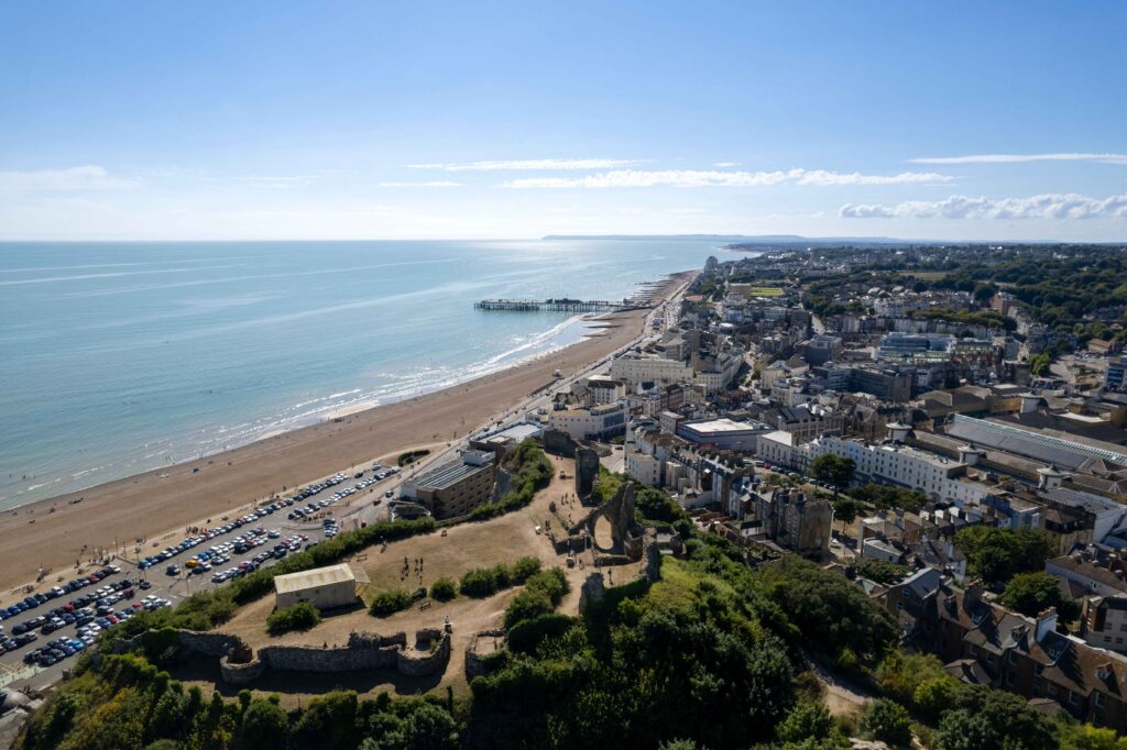 General aerial view from Hastings Castle, England, showcasing the landscape with subtle hints of potential car recovery