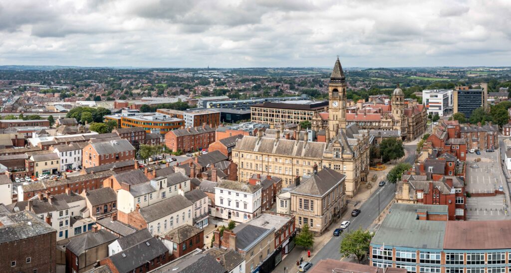 Aerial panorama of Wakefield Town Hall, West Yorkshire, combining civic grandeur with hints of car recovery scenarios