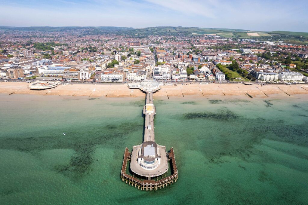 Above Worthing, England, a panoramic view with coastal allure and subtle suggestions of potential car recovery scenarios