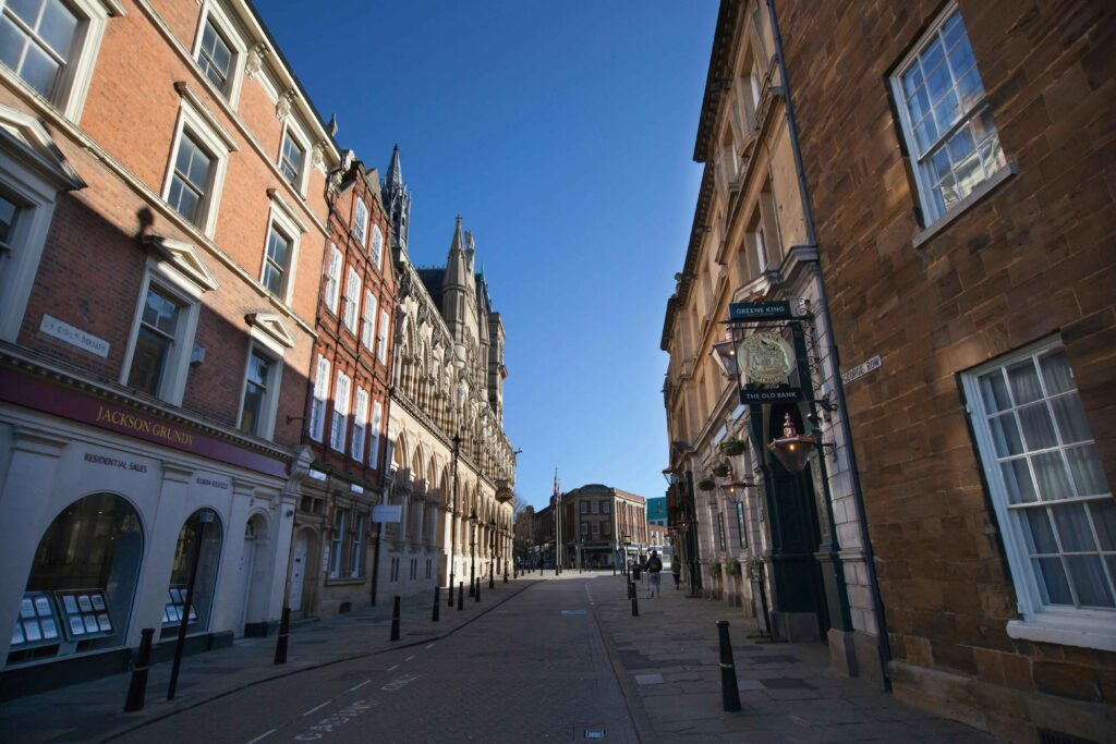 Northampton town, UK, urban charm with subtle elements suggesting the possibility of car recovery scenes in the cityscape