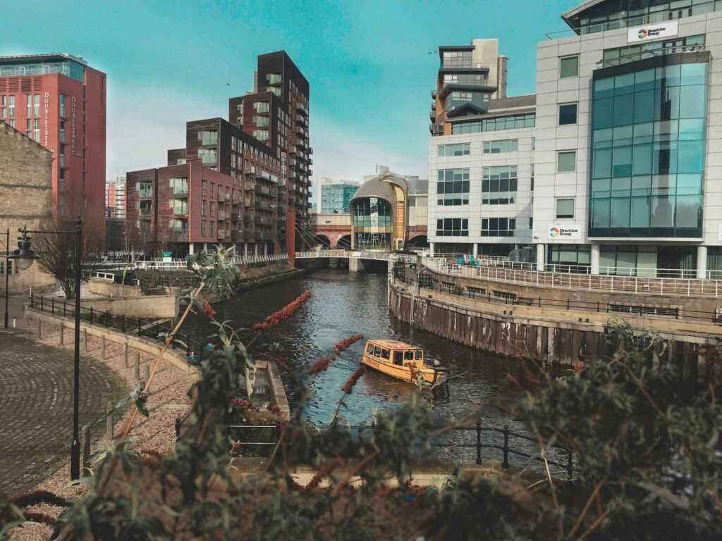 River Aire at Granary Wharf, Leeds, a scenic waterway with subtle hints suggesting potential car recovery scenarios along its banks