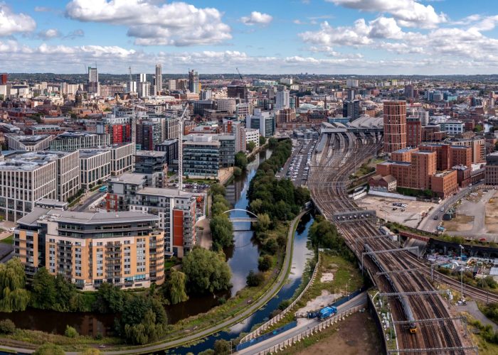 Aerial panorama of Leeds Railway Station, a dynamic scene with subtle hints of potential car recovery scenarios